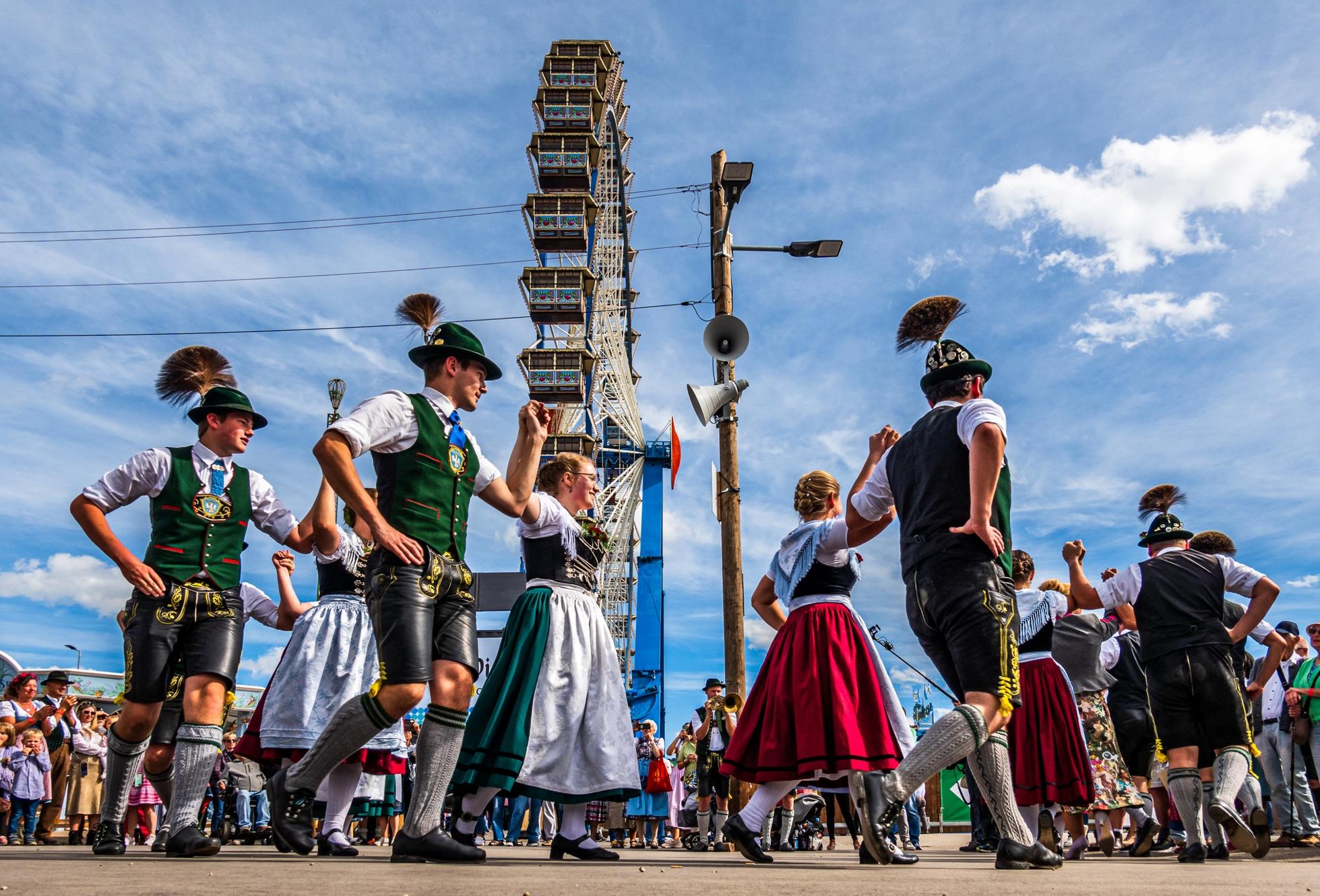 Typical Bavarian dancers in traditional clothing at Oktoberfest